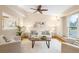 Cozy living room featuring vaulted ceilings, neutral tones, and ample seating at 8512 W Star Cir, Littleton, CO 80128