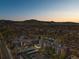 Stunning aerial view of the neighborhood with majestic mountain backdrop at sunset at 2227 Canyon Blvd # 162B, Boulder, CO 80302