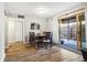 Bright dining room features a sliding door to the patio and wood floors at 2227 Canyon Blvd # 162B, Boulder, CO 80302