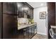 Well-appointed kitchen features modern appliances, granite countertops, and dark cabinetry at 2227 Canyon Blvd # 162B, Boulder, CO 80302