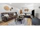 Inviting living room features wood floors, neutral walls, decorative elements, and comfortable seating arrangement at 2227 Canyon Blvd # 162B, Boulder, CO 80302