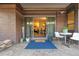 Cozy patio with brick facade, modern furniture, and a glimpse into the bright, open living space at 2227 Canyon Blvd # 162B, Boulder, CO 80302