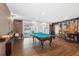 Recreation room featuring a pool table, stylish seating, and wood flooring at 2227 Canyon Blvd # 162B, Boulder, CO 80302