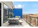 Relaxing balcony with comfortable seating and city views, perfect for outdoor enjoyment at 3198 Blake St # 502, Denver, CO 80205