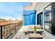 Relaxing balcony with outdoor seating and a scenic city view at 3198 Blake St # 502, Denver, CO 80205