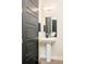Contemporary bathroom with a stylish vanity, mirror, and modern fixtures at 3198 Blake St # 502, Denver, CO 80205
