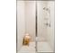 Modern bathroom shower with glass doors and updated tile work at 3198 Blake St # 502, Denver, CO 80205
