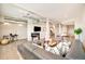 Spacious living room with a fireplace, duct work, and an open concept floor plan with hardwood floors at 3198 Blake St # 502, Denver, CO 80205
