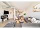 Living room area boasts duct work, an electric fireplace, an open concept, and hardwood floors at 3198 Blake St # 502, Denver, CO 80205