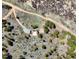 Aerial view of the property, surrounded by a wooded landscape at 548 Coughlin Meadows Rd, Boulder, CO 80302
