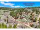 Property outline for illustrative purposes in an aerial view of a secluded red home at 548 Coughlin Meadows Rd, Boulder, CO 80302