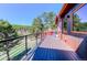 Outdoor deck overlooking scenic landscape with metal railings at 548 Coughlin Meadows Rd, Boulder, CO 80302