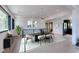 Virtually staged dining room featuring an oval dining table and black accent wall at 548 Coughlin Meadows Rd, Boulder, CO 80302