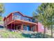 Charming two-story home with a spacious outdoor deck and abundant natural light and trees at 548 Coughlin Meadows Rd, Boulder, CO 80302