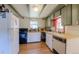 The kitchen has an exposed beam ceiling, wood floors, updated appliances, and an eat-in breakfast area at 548 Coughlin Meadows Rd, Boulder, CO 80302