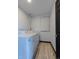 Functional laundry room with a washer, dryer, and wood-look flooring at 548 Coughlin Meadows Rd, Boulder, CO 80302
