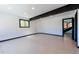 Bright and open living room with large windows, recessed lighting, and a door to the exterior at 548 Coughlin Meadows Rd, Boulder, CO 80302