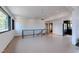 Bright living room with recessed lighting, modern railing and access to the kitchen at 548 Coughlin Meadows Rd, Boulder, CO 80302