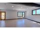 Spacious living room featuring bright white walls, recessed lighting, and natural light from multiple windows at 548 Coughlin Meadows Rd, Boulder, CO 80302