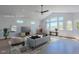 Virtually staged living room featuring vaulted ceilings and bright, scenic views at 548 Coughlin Meadows Rd, Boulder, CO 80302