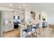 Modern kitchen featuring an island with seating, stainless steel appliances, and a sleek design at 22315 E 6Th Ave, Aurora, CO 80018