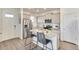 Modern kitchen with an island, stainless steel appliances, granite countertops, and sleek cabinetry at 22315 E 6Th Ave, Aurora, CO 80018