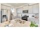 Well-equipped kitchen featuring granite countertops, stainless steel appliances, and ample cabinet space at 22315 E 6Th Ave, Aurora, CO 80018