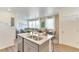 Bright, open kitchen featuring a granite-top island and stainless steel appliances at 22315 E 6Th Ave, Aurora, CO 80018