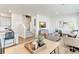 Inviting living room area with neutral paint, wood flooring and a wall-mounted TV at 22315 E 6Th Ave, Aurora, CO 80018