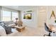 Cozy living room featuring carpet flooring, work desk and decorative accents at 22315 E 6Th Ave, Aurora, CO 80018