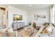 Cozy living room featuring stylish furnishings, a mounted TV, and neutral decor at 22315 E 6Th Ave, Aurora, CO 80018