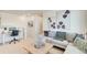 Comfortable living room area featuring soft carpet, a work desk and a comfy sofa at 22315 E 6Th Ave, Aurora, CO 80018