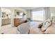 Comfortable bedroom with natural light, wood dresser and modern decor at 22315 E 6Th Ave, Aurora, CO 80018