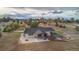 An aerial view of a large estate with patio, fire pit, and beautiful landscaping at 12628 N 3Rd St, Parker, CO 80134
