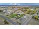 Expansive aerial view of estate with white fencing, lush landscaping, barn and sprawling grounds at 12628 N 3Rd St, Parker, CO 80134