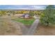 Aerial view showing house, driveway, and surrounding landscape at 12628 N 3Rd St, Parker, CO 80134