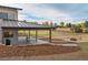 The covered backyard patio features outdoor seating, a fire pit, and landscaping at 12628 N 3Rd St, Parker, CO 80134