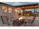 Relaxing backyard patio with fire pit, seating, and covered dining area at 12628 N 3Rd St, Parker, CO 80134