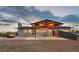 Covered patio with dining area and fire pit, perfect for outdoor entertaining at 12628 N 3Rd St, Parker, CO 80134