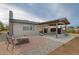 Well-maintained backyard showcasing a patio, a fire pit and outdoor seating areas at 12628 N 3Rd St, Parker, CO 80134