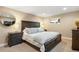Comfortable bedroom with neutral paint, carpeted floors, bright light and stylish furniture at 12628 N 3Rd St, Parker, CO 80134