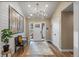 Bright and airy entryway with wood floors and bench at 12628 N 3Rd St, Parker, CO 80134