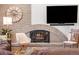 Stone fireplace with a modern arched mantle at 12628 N 3Rd St, Parker, CO 80134