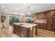 Eat-in kitchen with island, stainless steel appliances, and views at 12628 N 3Rd St, Parker, CO 80134
