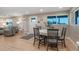 Open floor plan reveals a dining area and living room with modern flooring and bright, natural light at 12628 N 3Rd St, Parker, CO 80134