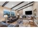 Open living area with fireplace, vaulted ceiling and large windows at 12628 N 3Rd St, Parker, CO 80134