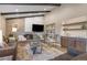 Inviting living room showcasing a stone fireplace, vaulted ceilings, and a stylish bar area at 12628 N 3Rd St, Parker, CO 80134
