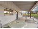 Covered patio with seating area and string lights at 12628 N 3Rd St, Parker, CO 80134