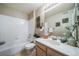 Bathroom with tile bath tub, vanity with decor and neutral walls at 9911 E Idaho Cir # 202, Denver, CO 80247