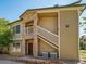 Exterior of a multi-story building with stone accents and well-maintained landscaping at 9911 E Idaho Cir # 202, Denver, CO 80247